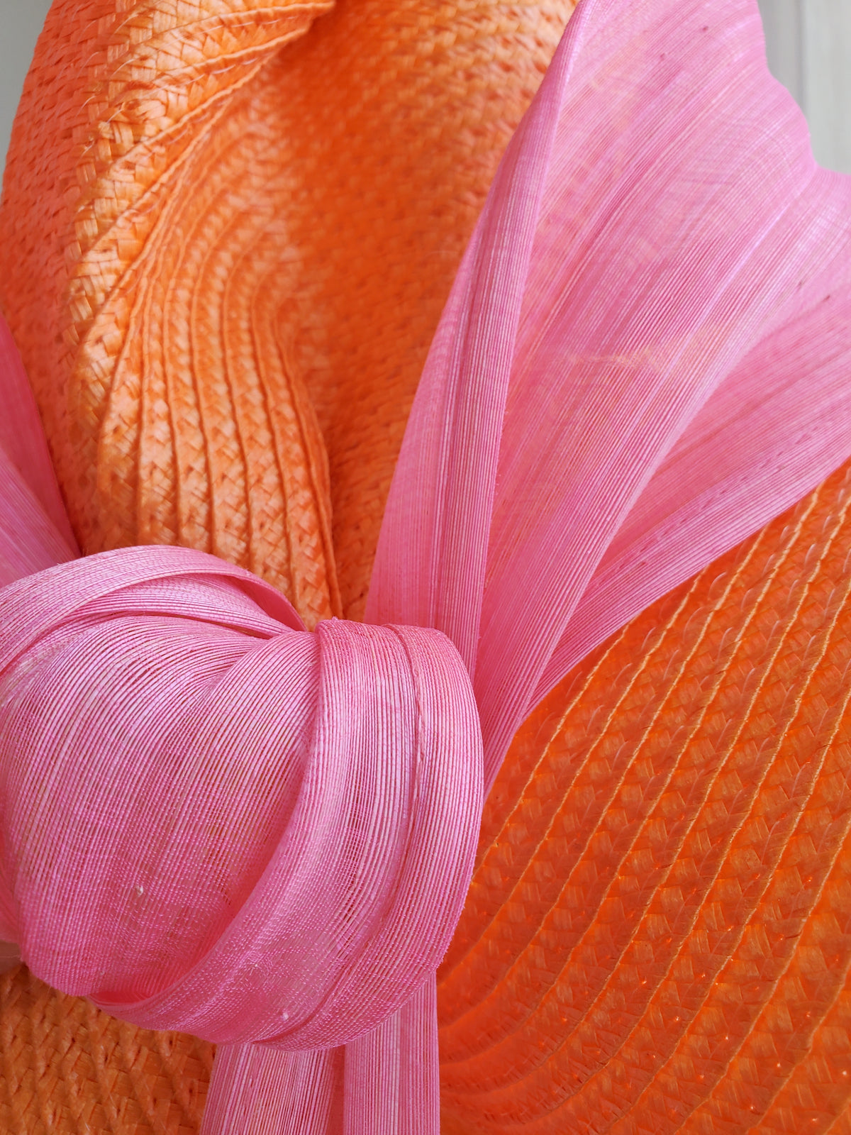 Orange Fascinator Hat with Pink Ribbon