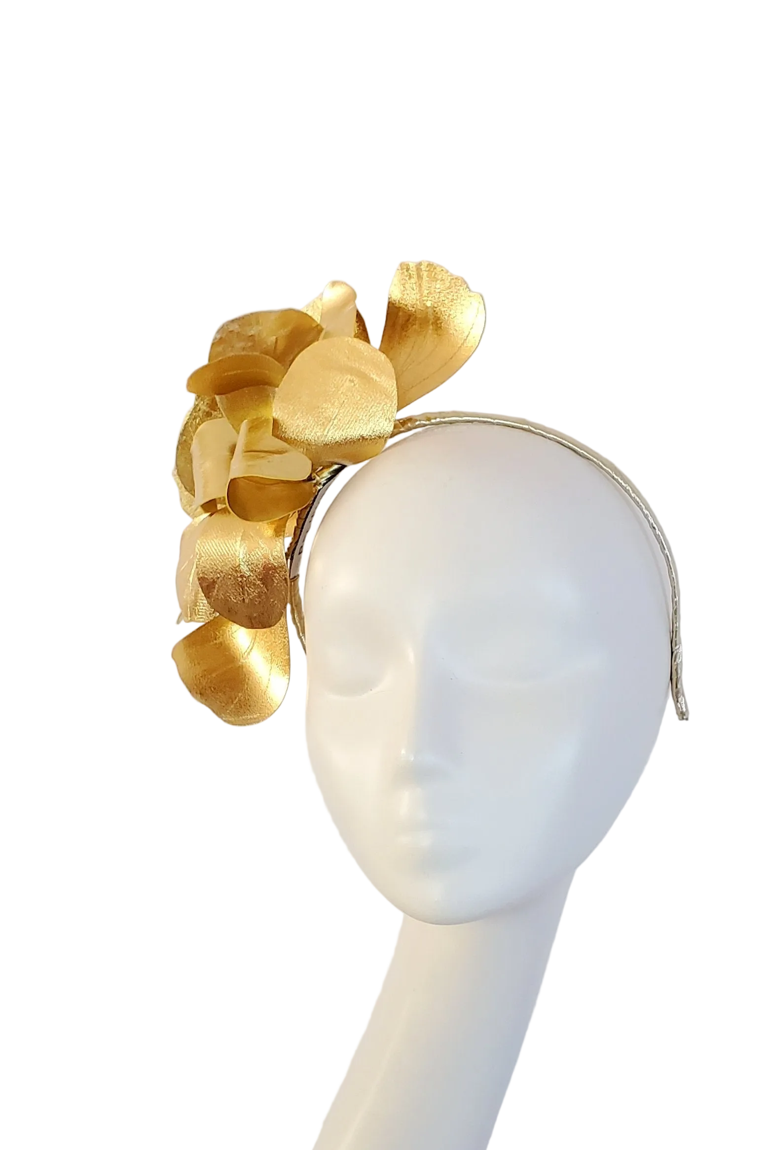 A gold metallic fascinator headpiece displayed on a white mannequin head against a white background.